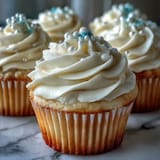 Festive Cancer birthday cupcakes with delicate pearl fondant toppers, perfect for celebrations.