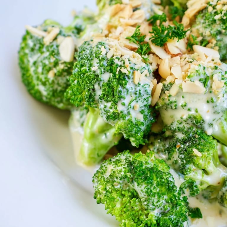 Freshly grated Parmesan and minced garlic blend into the smooth dressing over vibrant broccoli salad with red onion.  