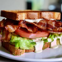 Crispy bacon, juicy tomatoes, and fresh lettuce enhance this delicious BLT Sandwich.