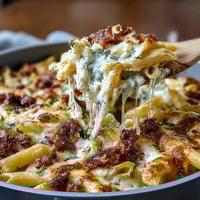 One-Pot Cheesy Pasta Bake with bubbling golden cheese and tender pasta in a rich tomato sauce.